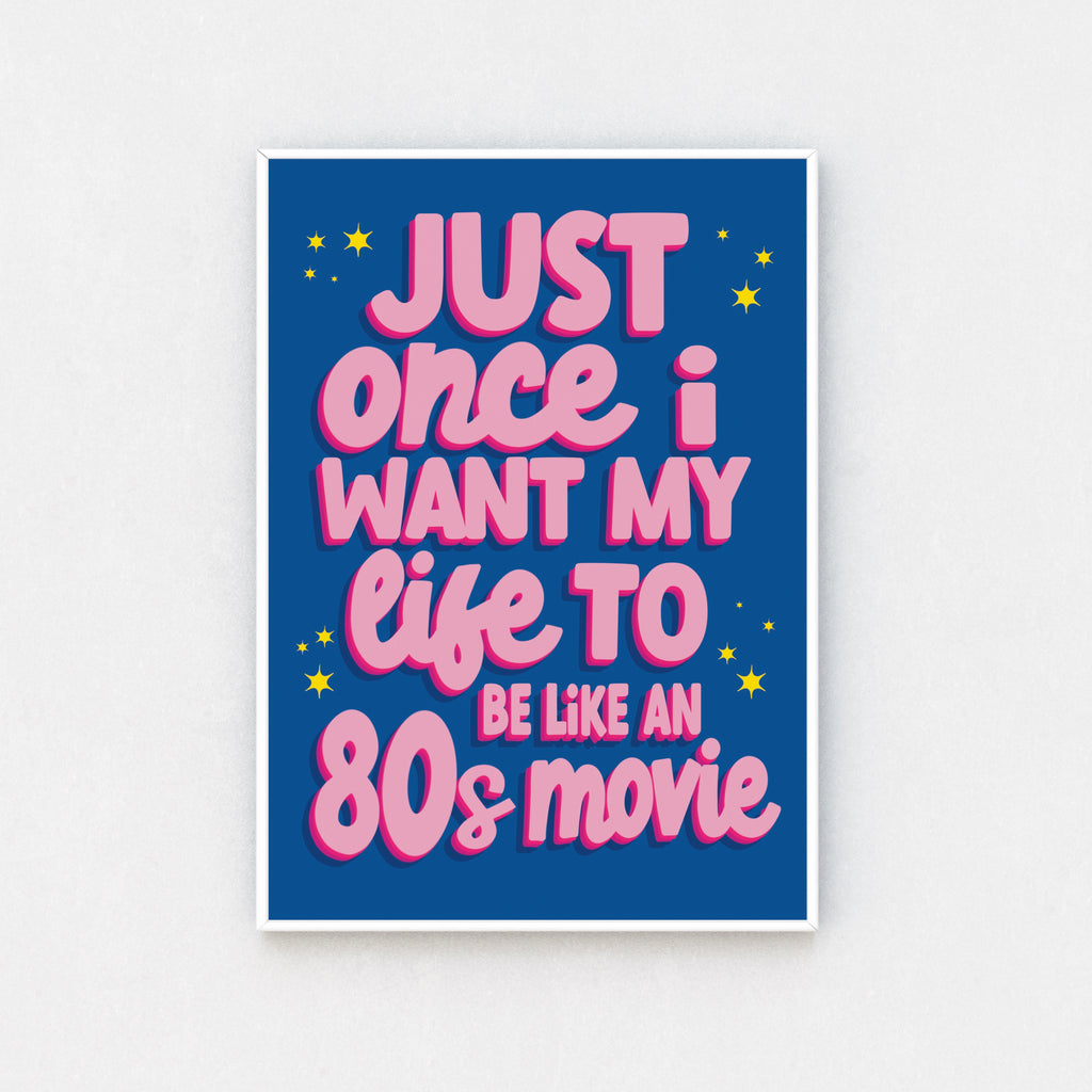 Chic wall art print featuring the quote "Just Once I Want My Life to Be Like an 80s Movie" in pink cursive font on a blue background.