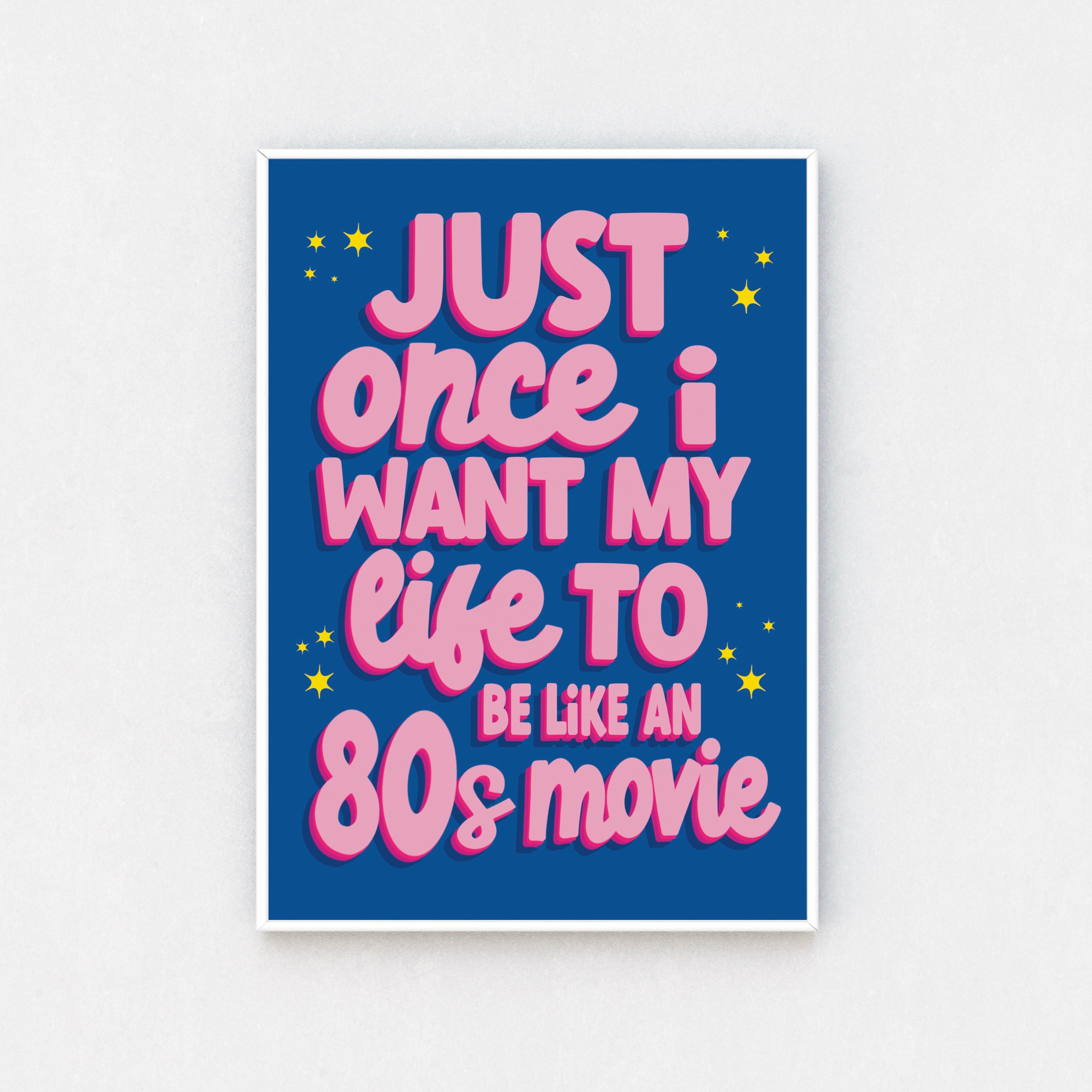 Chic wall art print featuring the quote "Just Once I Want My Life to Be Like an 80s Movie" in pink cursive font on a blue background.
