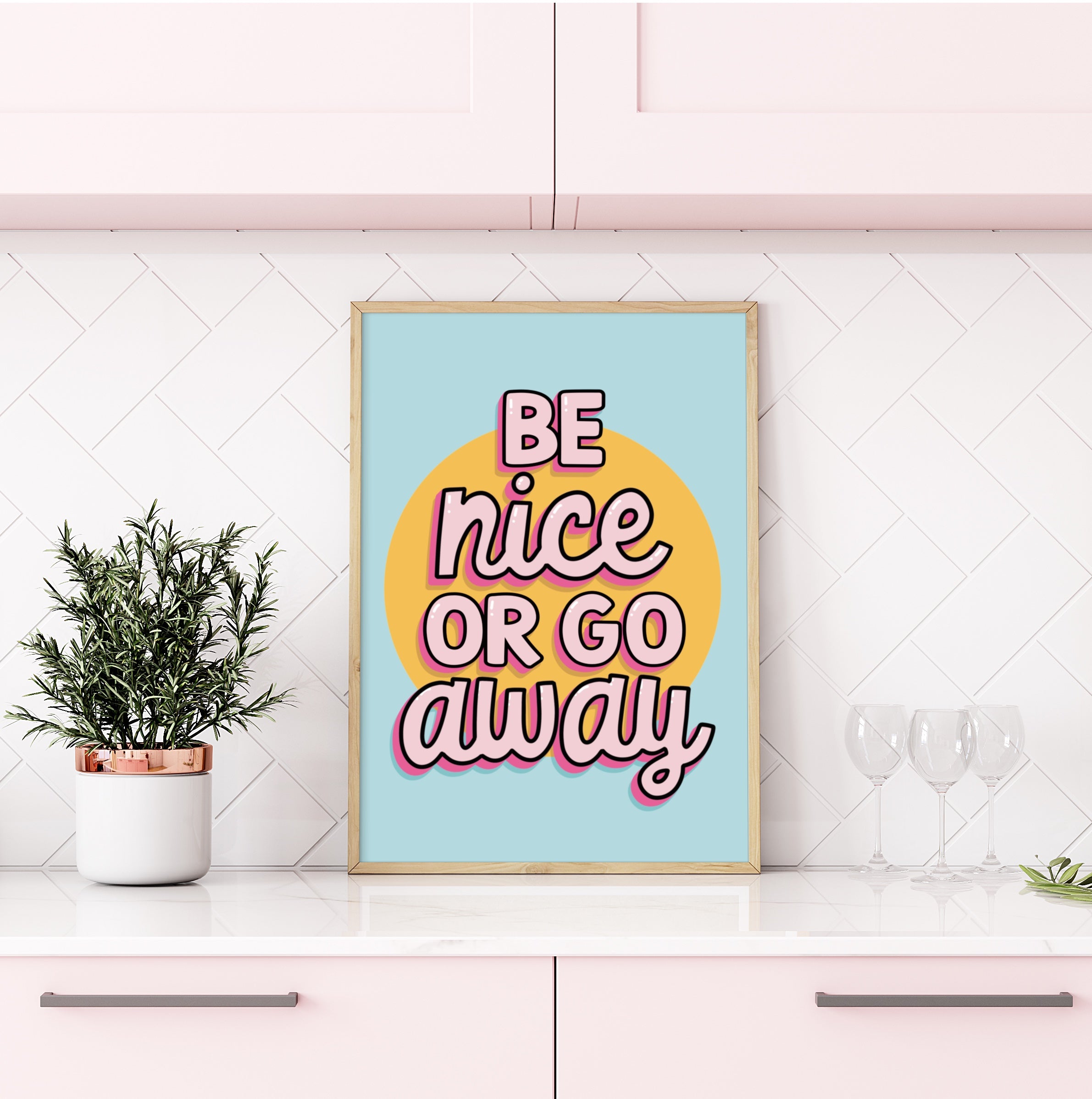 Colorful wall art print with the quote "Be Nice or Go Away" against a vibrant background.