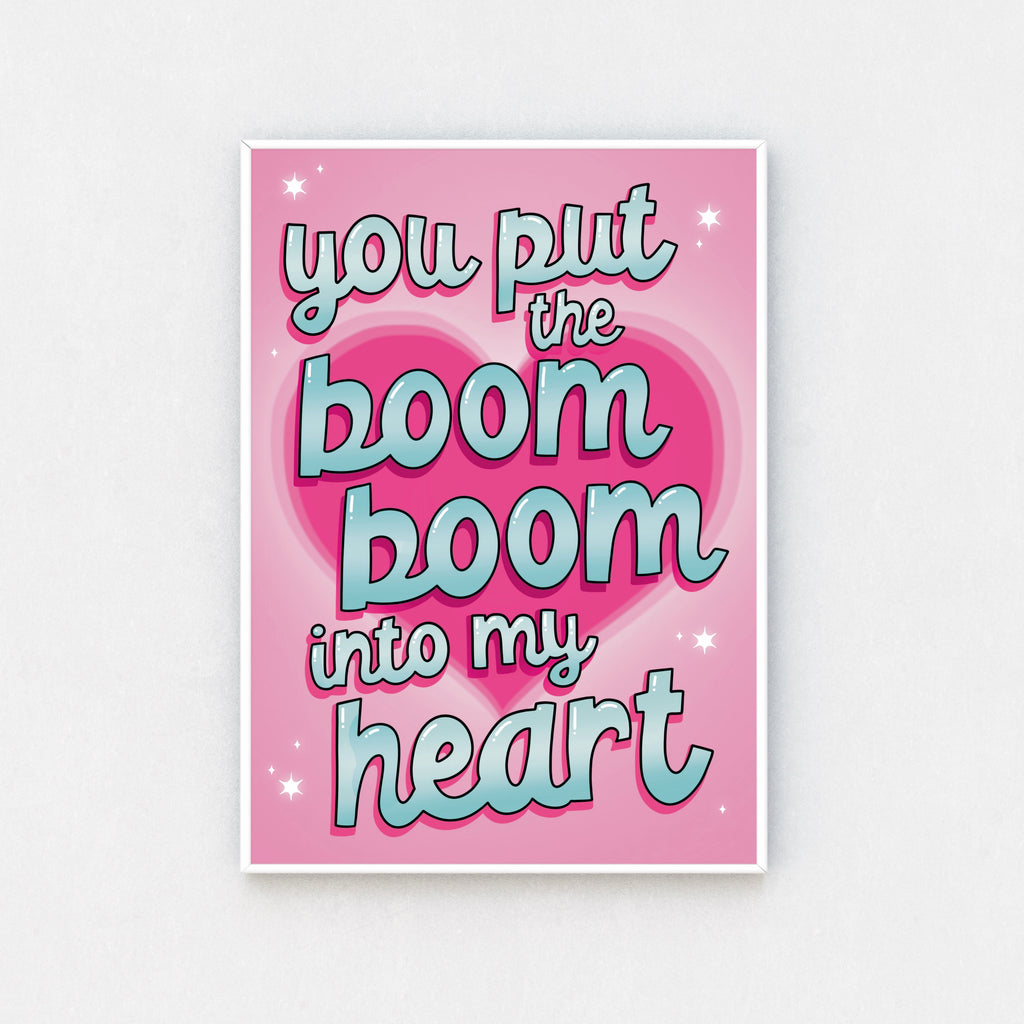 "Framed wall art: Colorful 'You Put the Boom Boom into My Heart' print, a tribute to 80s tunes."