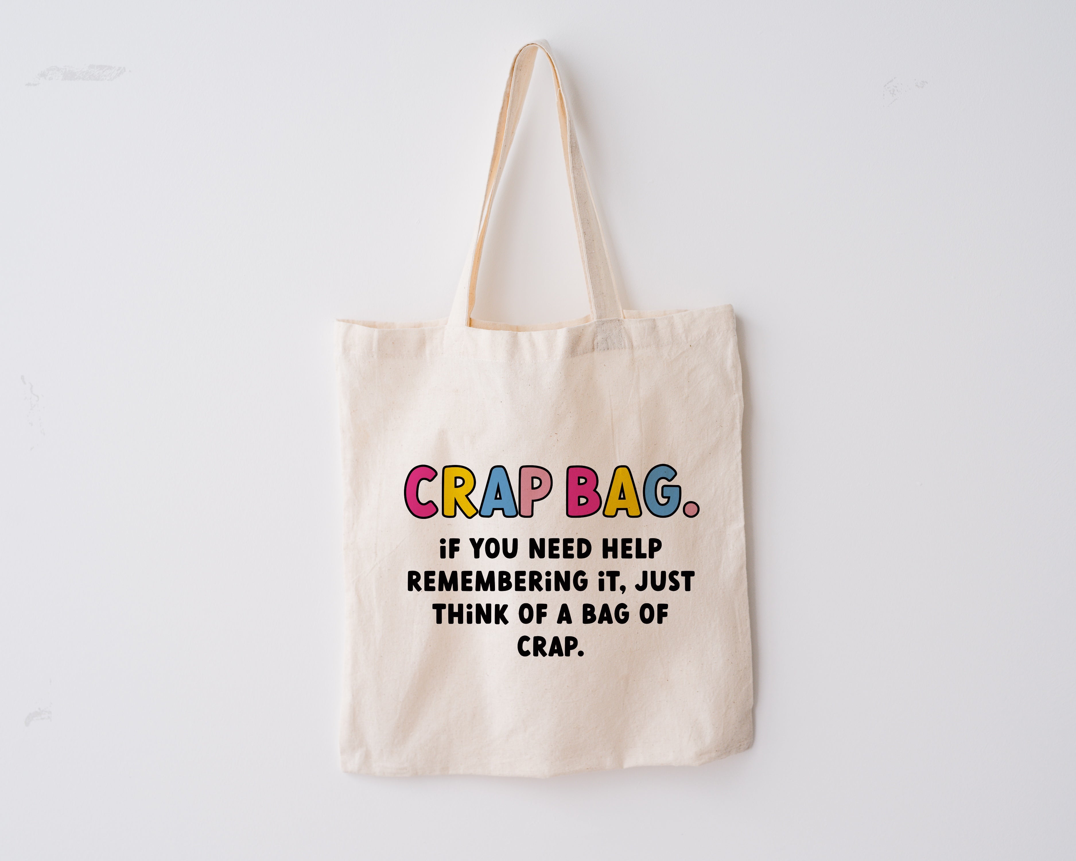 Colourful Tote bag with the quote "crap bag. If you need help remembering it, just think of a bag of crap." from the TV show 'Friends'