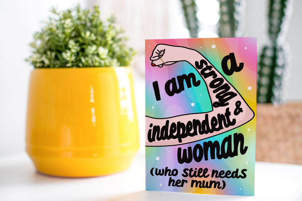 'Strong & Independent' Greeting Card Front: A vibrant image featuring the quote "I am a Strong & Independent Woman (Who Still Needs Her Mum)." Designed by Colourful Life, 5x7 inch size, with a smooth silk finish.