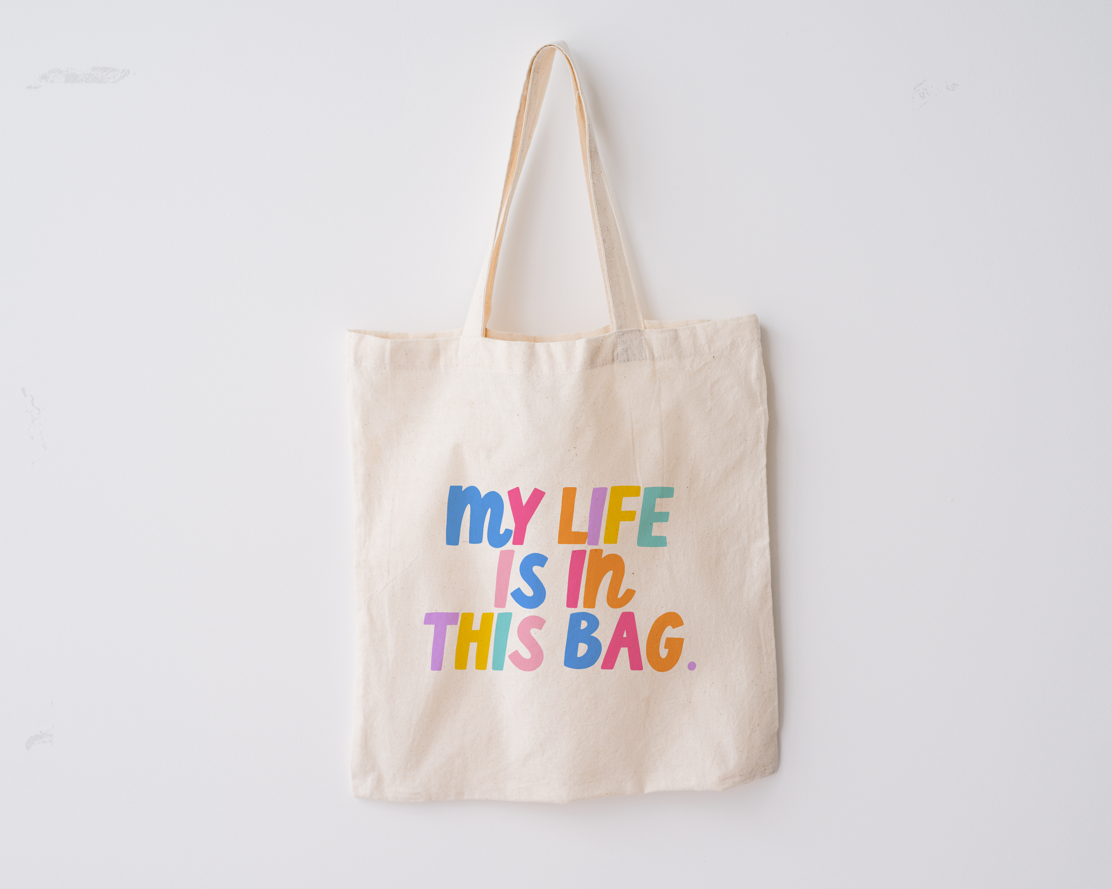 Fun Tote bag including the phrase 'my life is in this bag' in colorful block lettering
