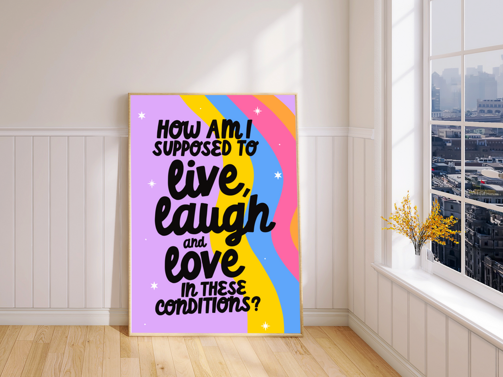 "Close-up of framed print: Quirky quote on rainbow wave background. Playful contrast in black cursive font."