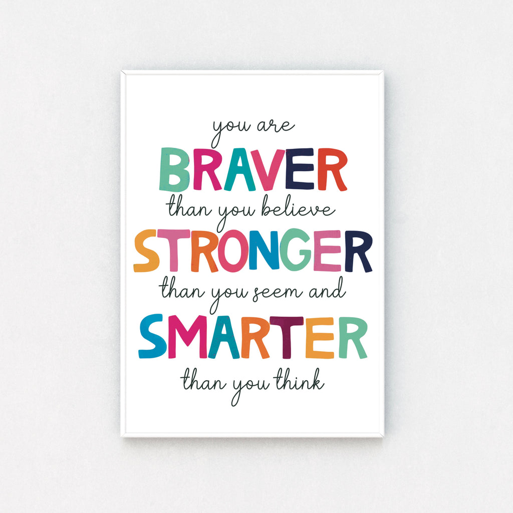 "Framed print: 'You Are Braver Than You Believe, Stronger Than You Seem and Smarter Than You Think' on crisp white backdrop, a daily reminder of your brilliance."
